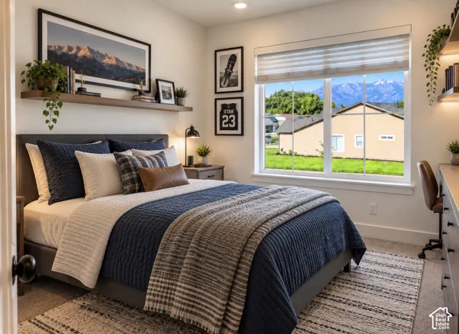 Bedroom  2: featuring large-format windows with mountain backdrops, wall-mounted floating wood shelves, and neutral carpeting