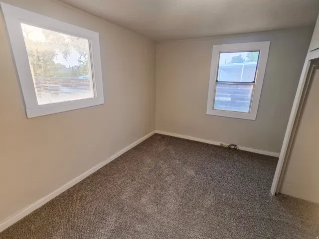 Neutral wall color, carpet flooring, and white trim