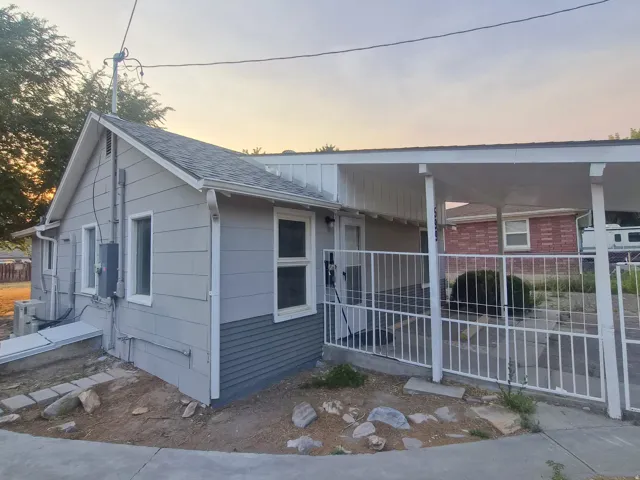 Light gray horizontal siding with dark gray foundation siding