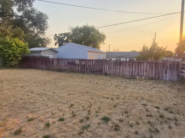 Rear property line defined by a wood picket fence