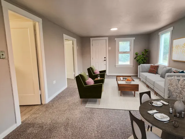 Recessed lighting and multiple windows illuminate this interior space