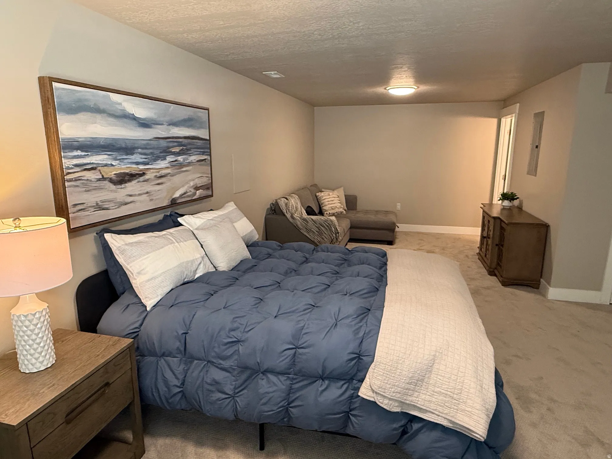 Huge 4th bedroom/family room in basement with Neutral-toned walls complement the plush carpeting