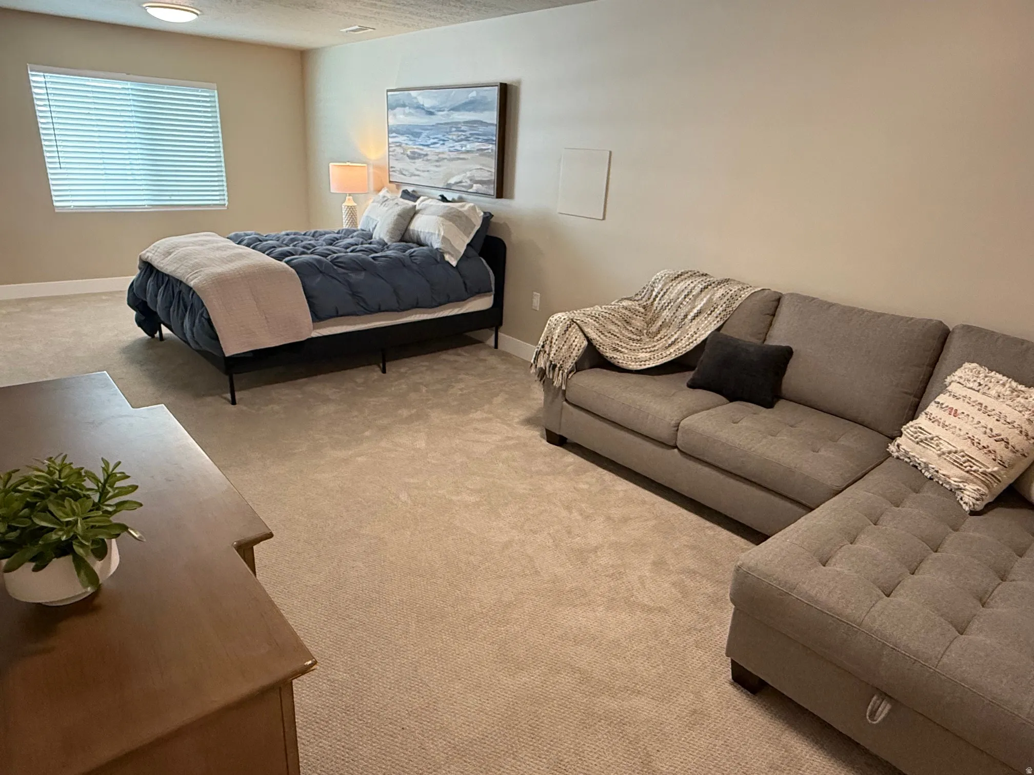 Carpeted flooring, recessed lighting, and a window with blinds