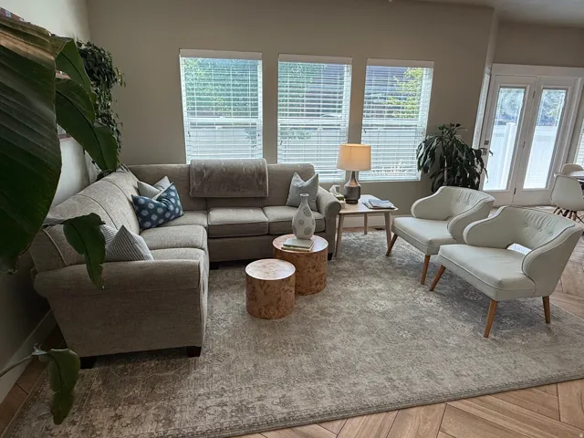 Wood-finish flooring, multiple windows with blinds, great natural light, and French doors