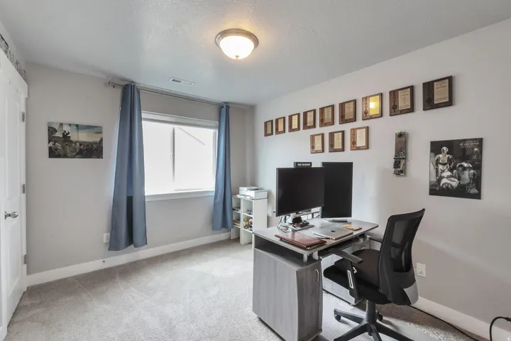 Recessed window with white trim, light gray wall paint, white door, and a ceiling-mounted light fixture