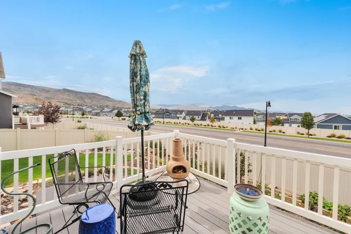 Expansive outdoor deck with composite decking and white railing