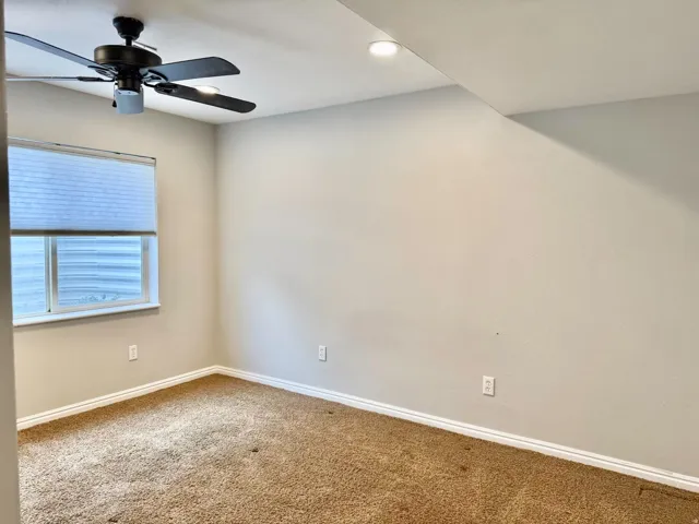 Recessed lighting, ceiling fan with light, window with blind, and neutral wall paint