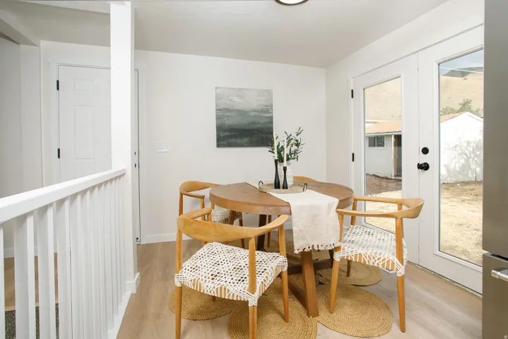 Recessed lighting with a white ceiling, light wood-finish flooring, and white interior walls