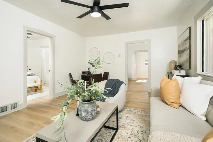 Recessed lighting, wood-finish flooring, and white painted walls