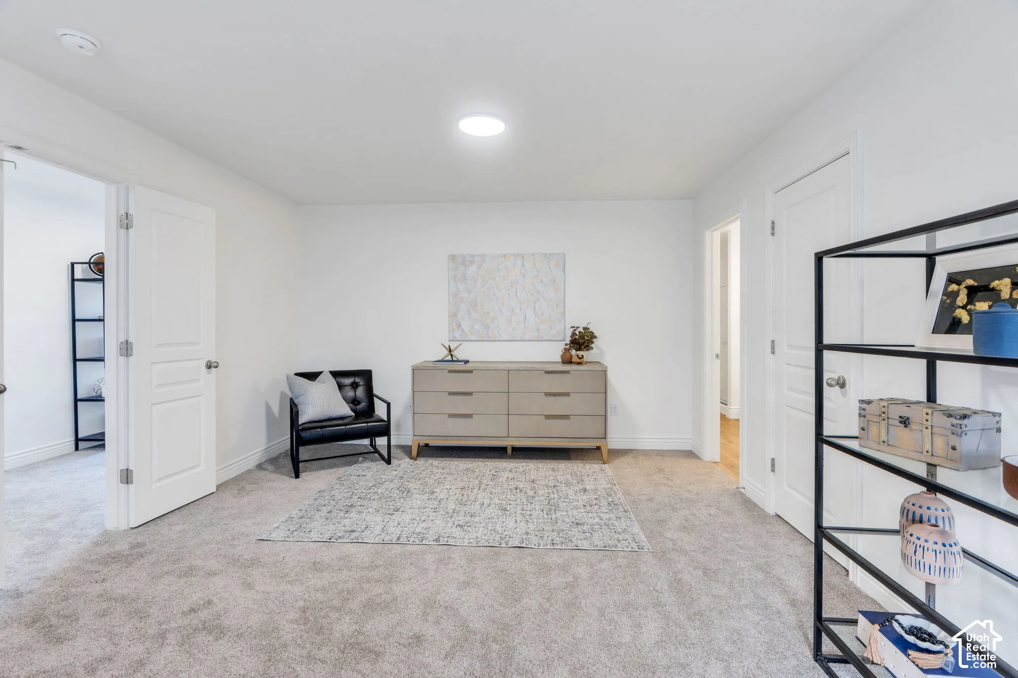 Wall-to-wall carpeting and white walls