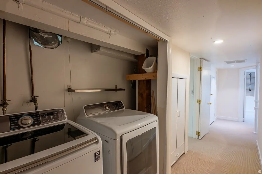 Laundry area with built-in shelving, providing functional utility space