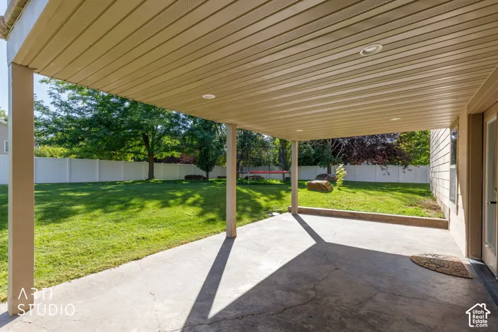 Covered patio with recessed lighting and concrete flooring