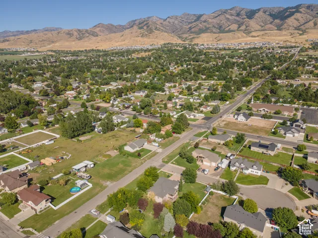 Mountain backdrop, established neighborhood, residential streets, mature trees, single-family residences