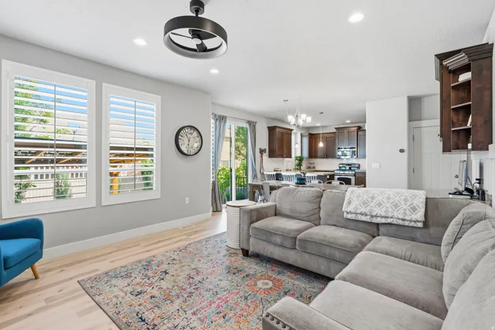 Light wood-finish flooring, recessed lighting, and a modern ceiling fan