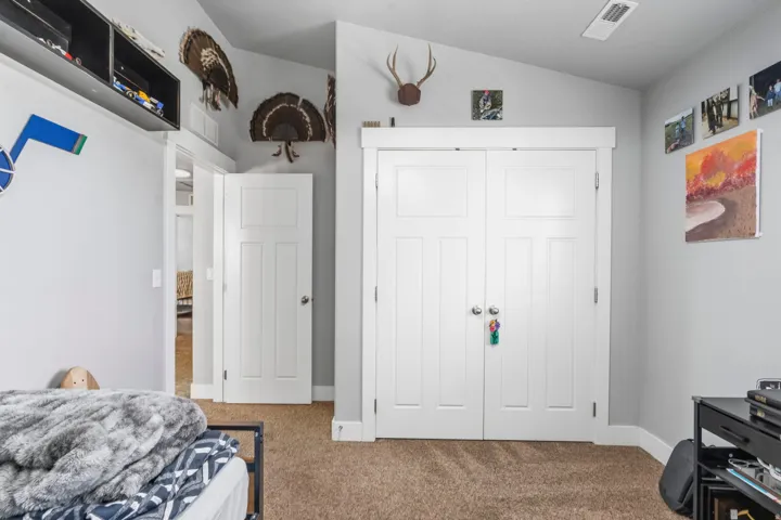Wall-to-wall carpeting with light gray walls and white trim