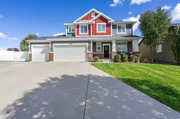 Multi-level residence featuring a prominent red and gray exterior