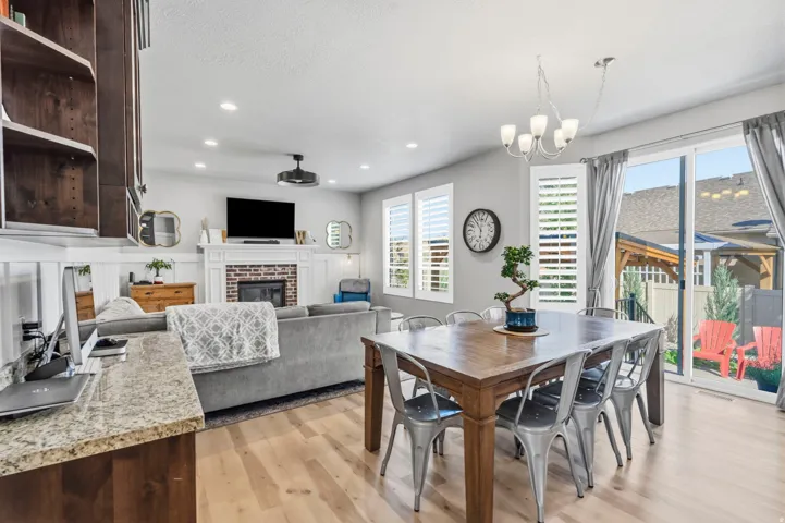 Open-concept living space featuring wood-finish flooring and recessed lighting