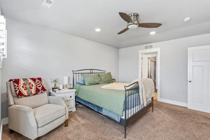 Recessed lighting, ceiling fan, white paneled doors, white trim, and light gray wall paint