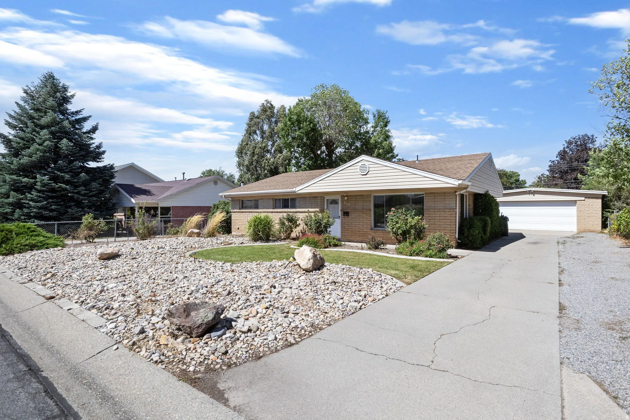 Brick exterior with light-colored siding accents