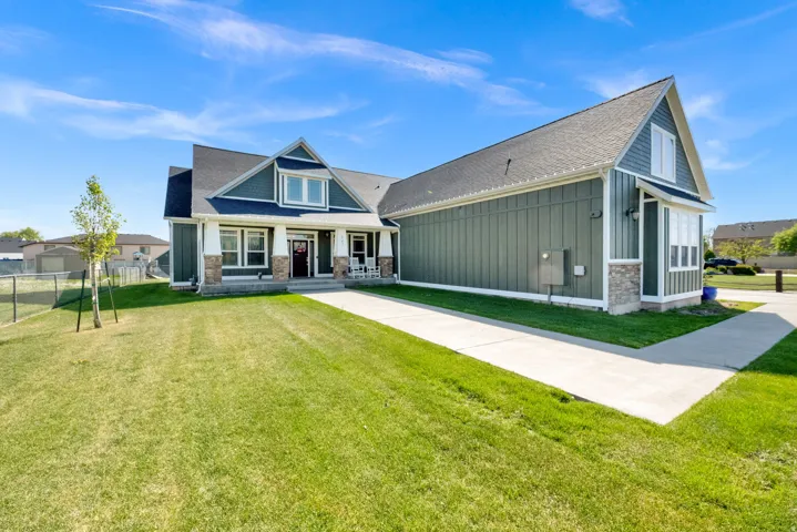 Contemporary craftsman-style exterior with stone accents and board and batten siding