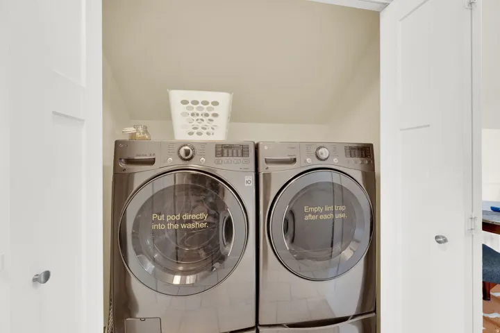 Integrated laundry area with modern front-loading washer and dryer