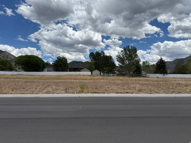 Expansive level lot with surrounding mountain backdrop