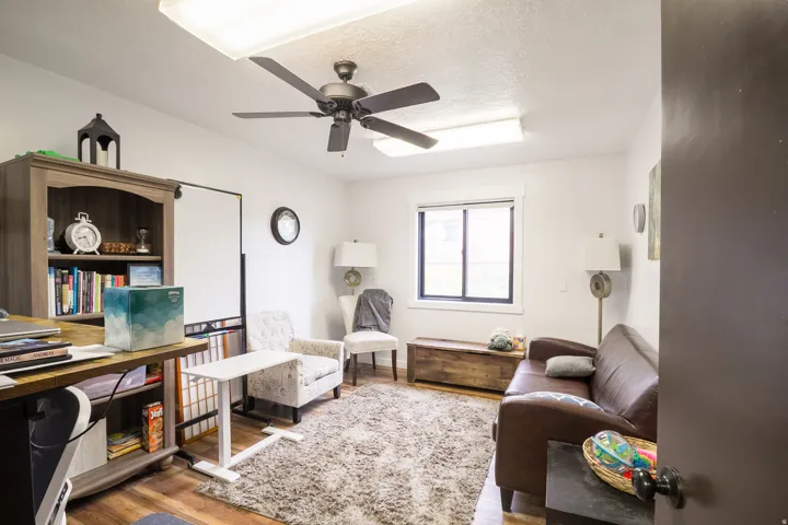Wood-finish flooring with a contrasting area rug