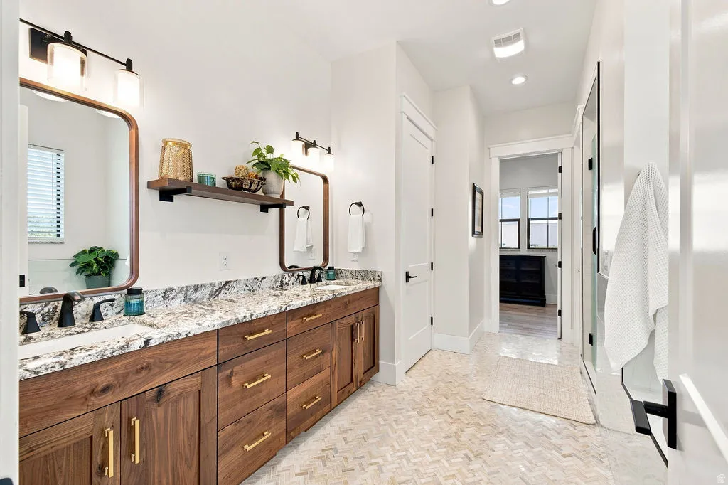 Dual vanity with stone countertops and integrated sinks