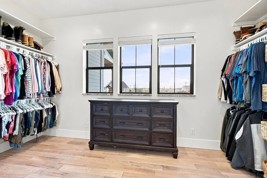 Custom closet system featuring built-in shelving and hanging rods