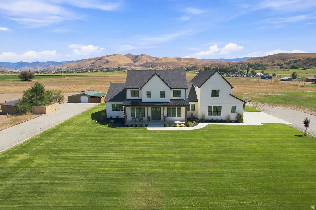 Modern farmhouse-style exterior with white siding and dark trim