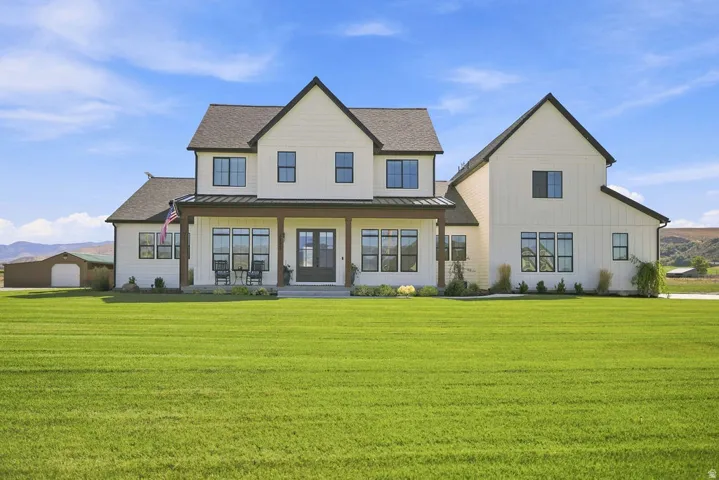 Modern farmhouse exterior with white vertical and horizontal siding