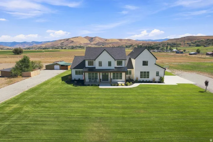 Modern farmhouse-style exterior with white siding and dark trim