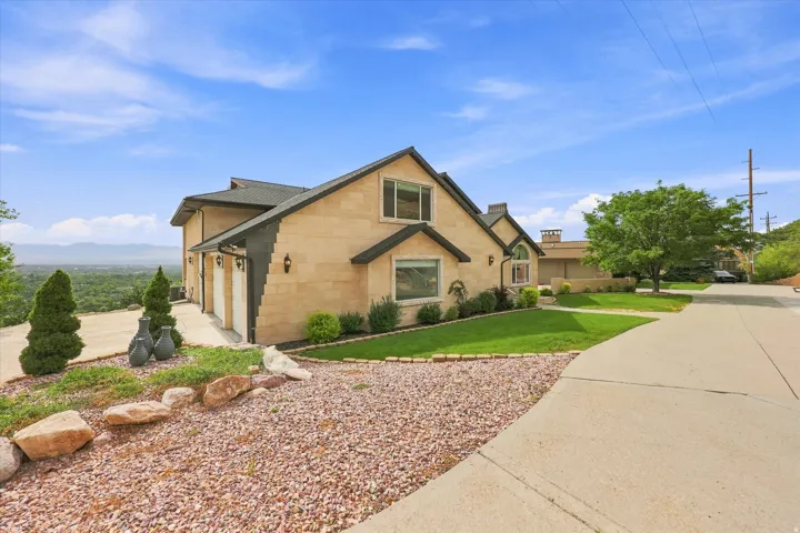 Stone veneer exterior with dark trim accents