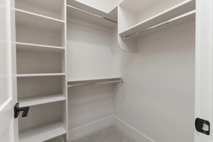 Integrated shelving system with multiple adjustable shelves and hanging rods