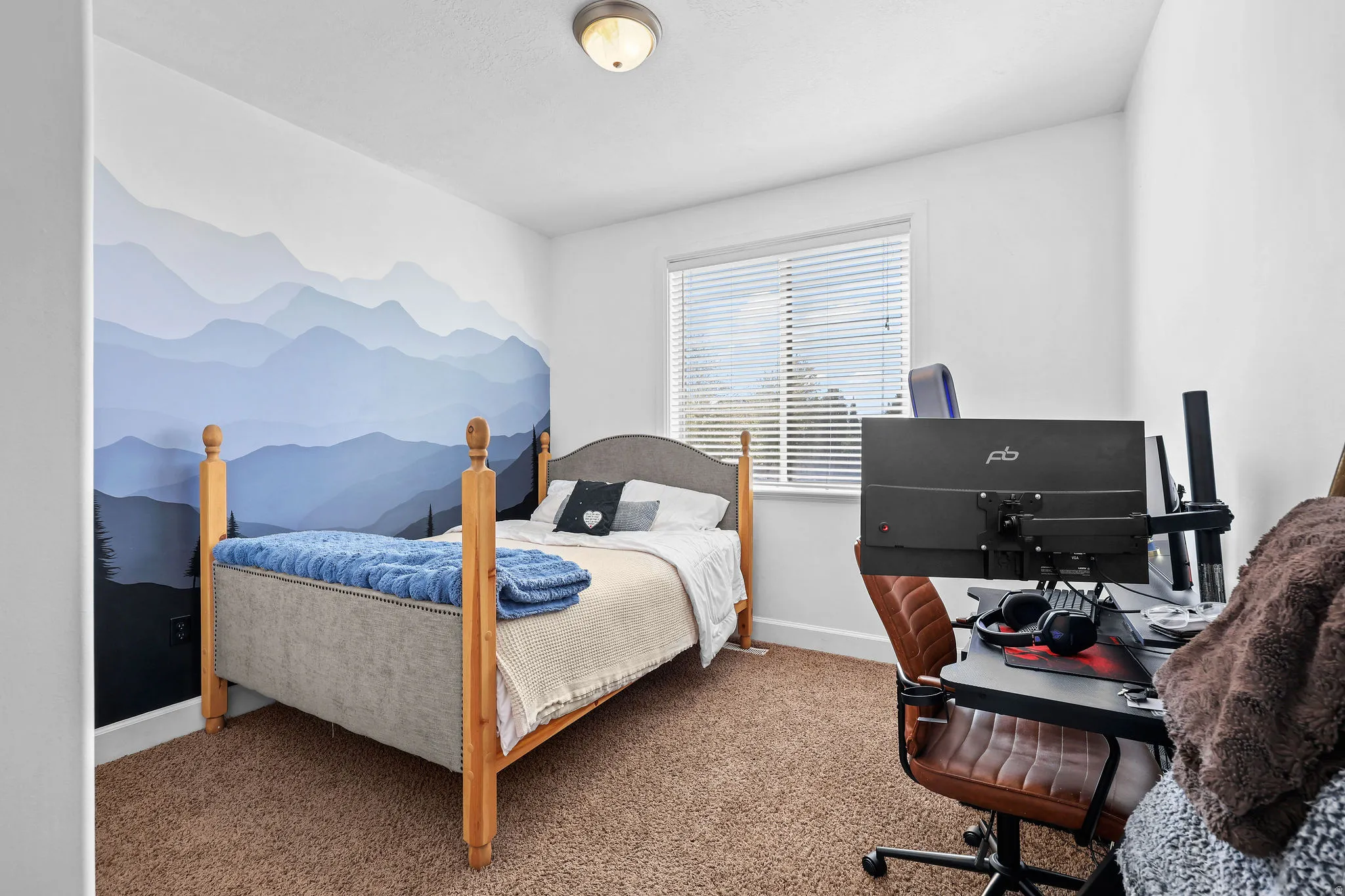 Carpeted flooring, white interior walls, window with horizontal blinds, and a flush mount ceiling light fixture