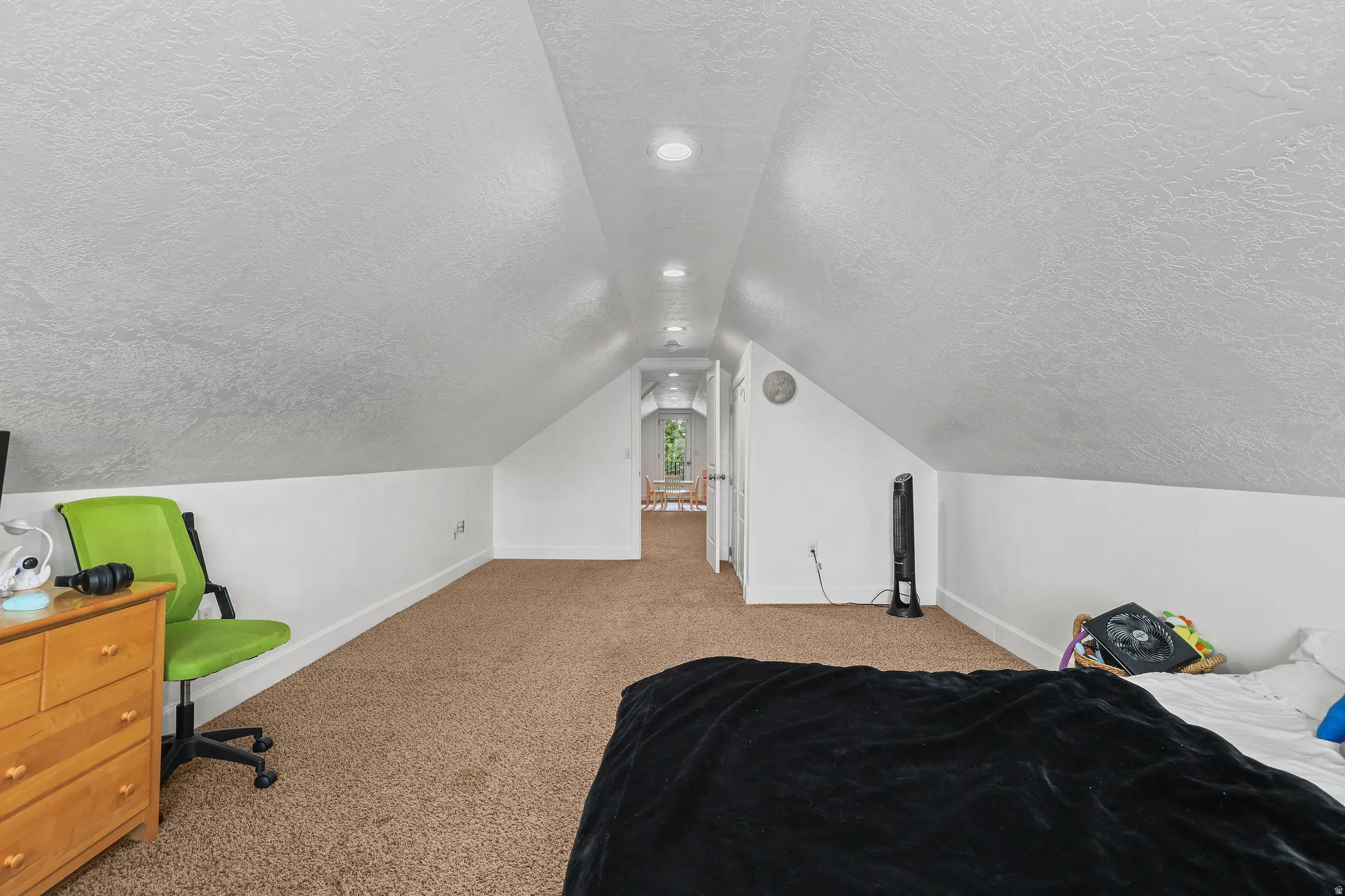 Carpeted flooring with recessed lighting, an angled ceiling, and white painted walls