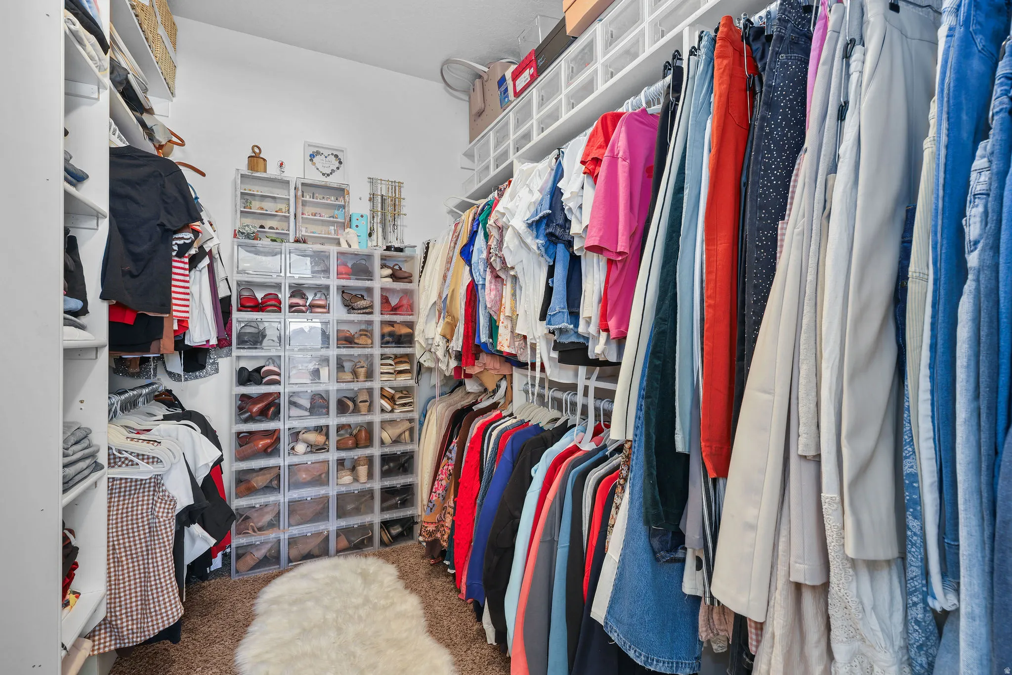 Built-in shelving, ample hanging storage, and overhead storage compartments