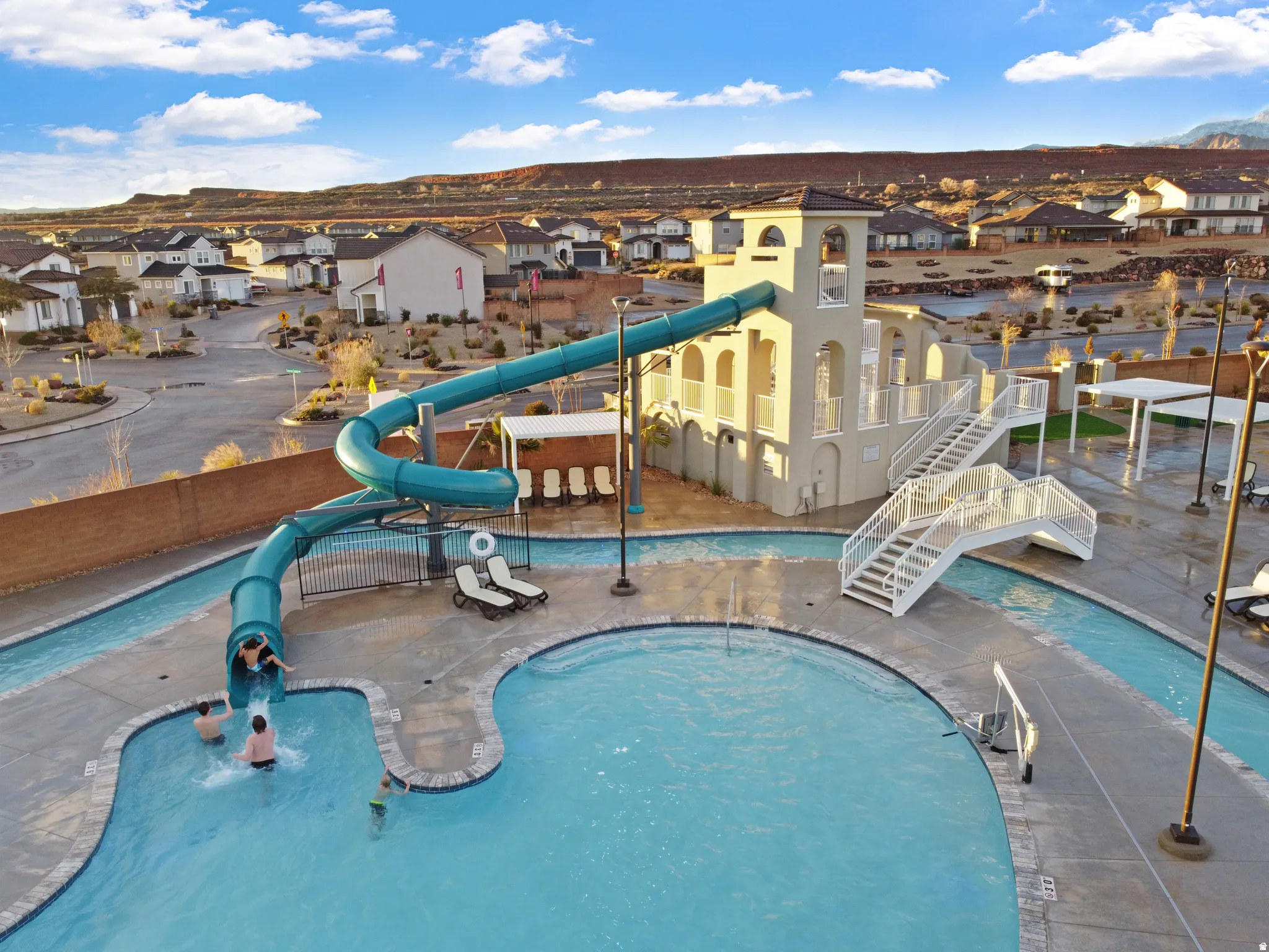 Community water slide structure with a lazy river and swimming pool