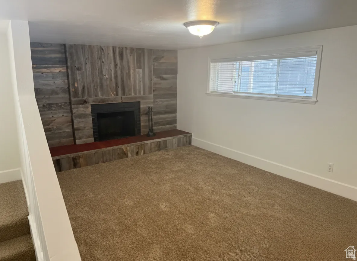 Fireplace featuring a wood-finish surround, hearth, and mantel