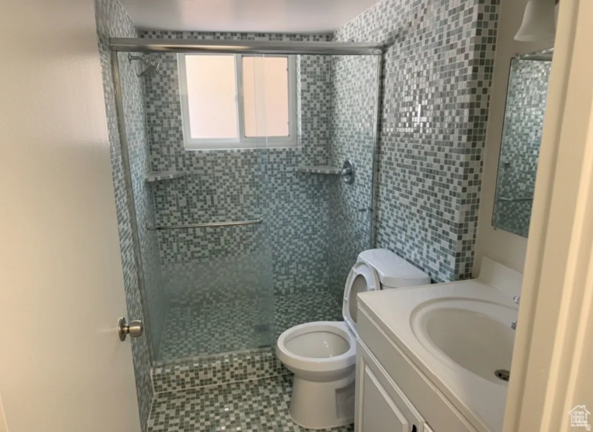 Shower enclosure with glass panel, mosaic tile walls, mosaic tile flooring, and a window