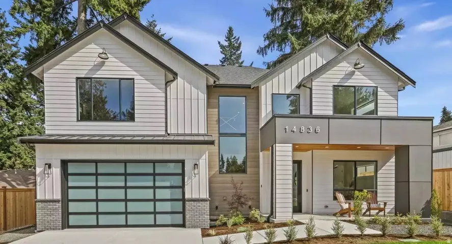 Contemporary residence featuring a striking architectural design with mixed materials