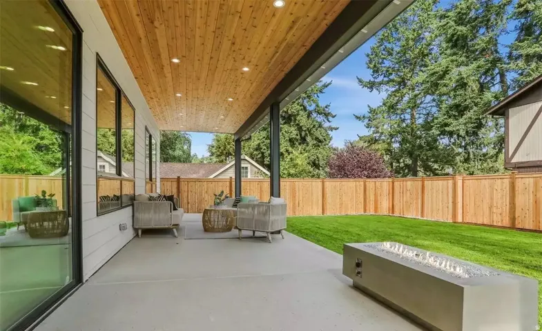 Covered patio featuring a wood-finish ceiling, recessed lighting, and a concrete slab