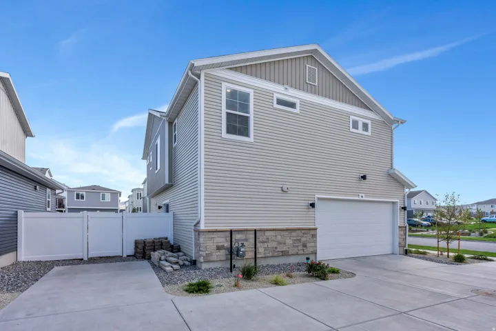 Siding exterior with stone-finish foundation. Snow Removal on Driveway covered by the HOA.