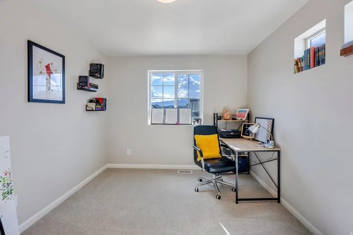 Light gray wall finish with a large window and smaller transom window