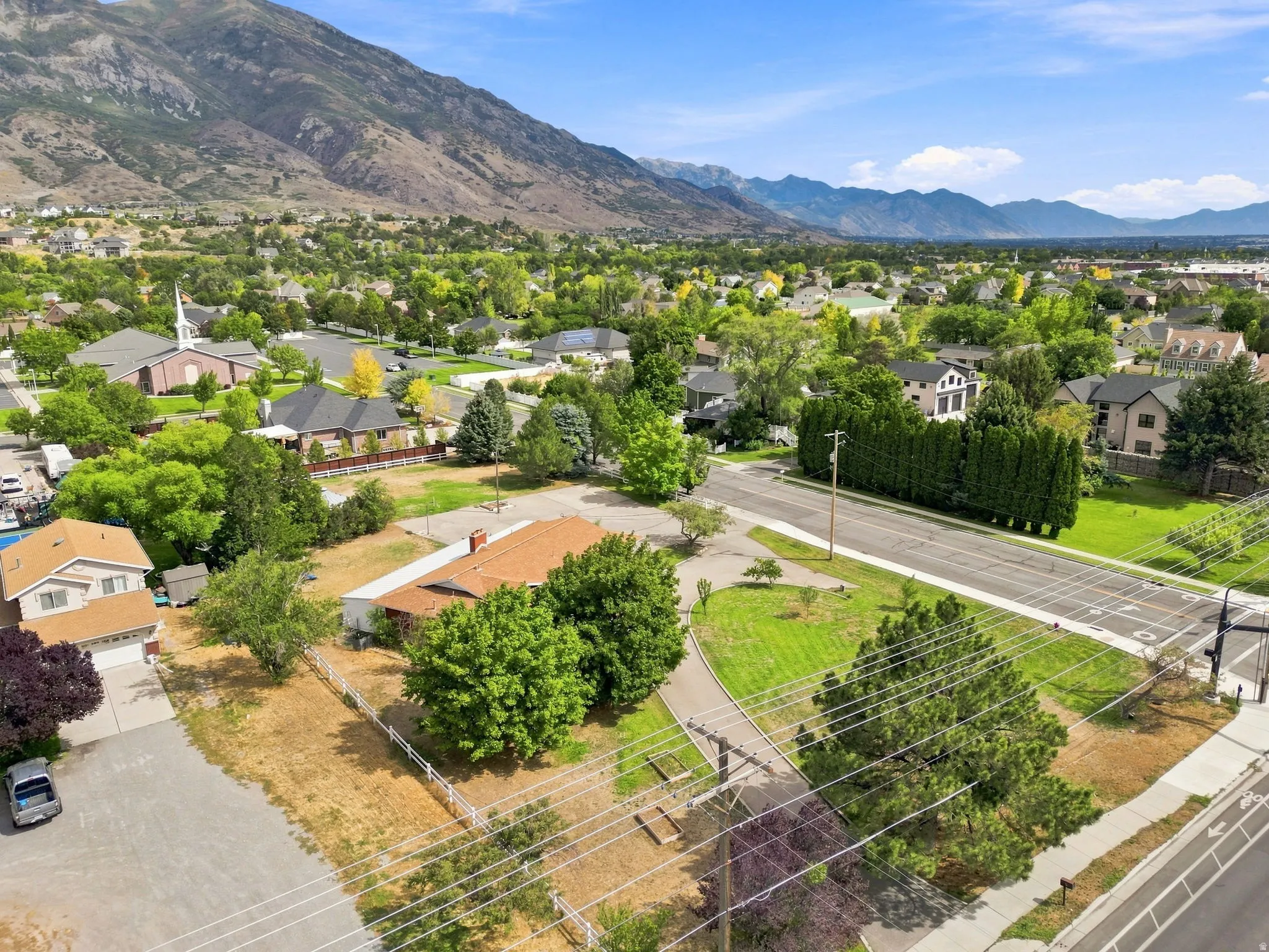 Expansive property featuring mature landscaping and mountain scenery