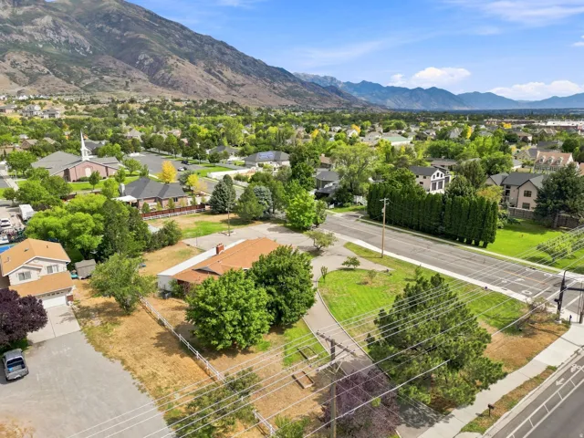 Expansive property featuring mature landscaping and mountain scenery
