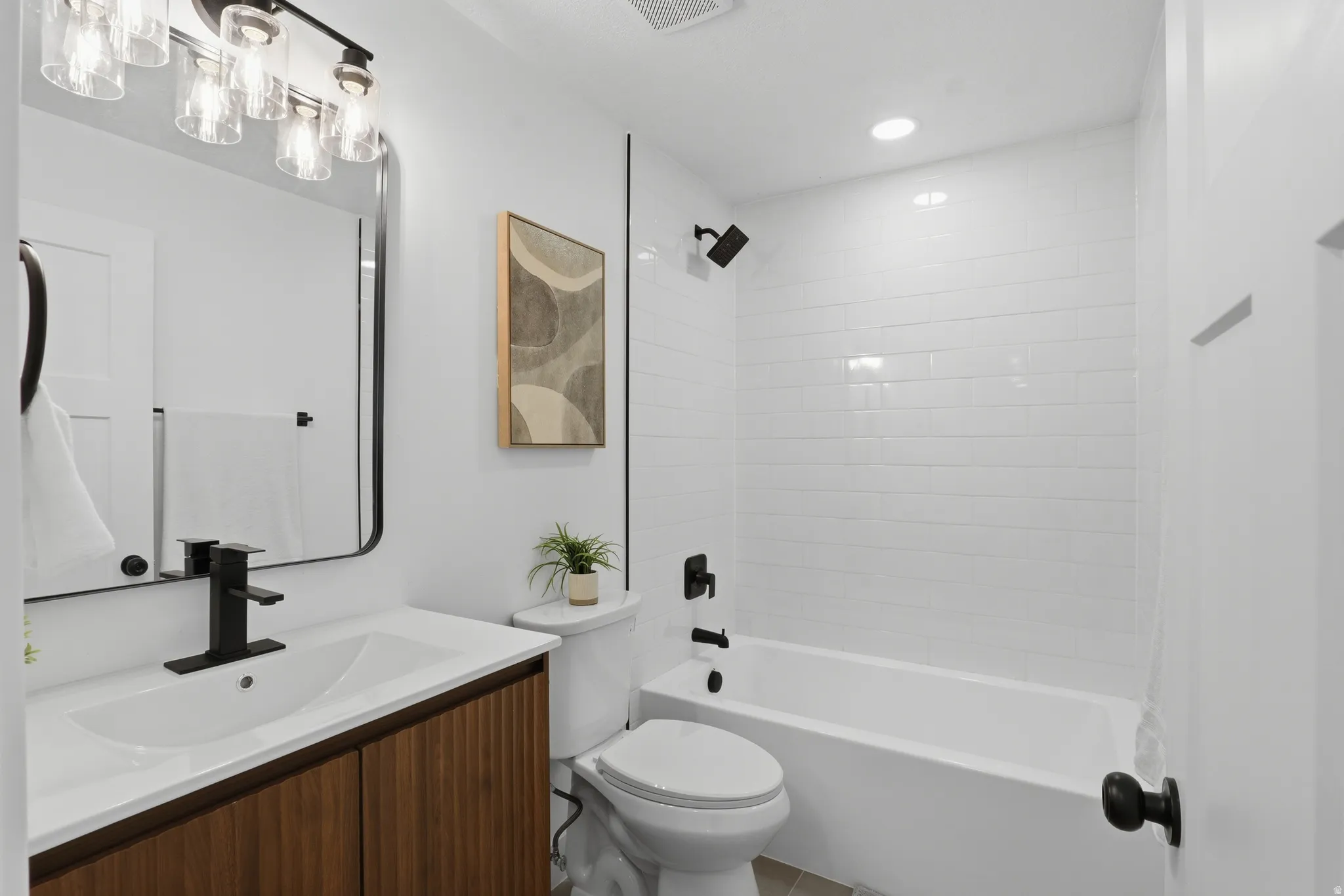 Modern vanity with wood-finish cabinetry and white countertop