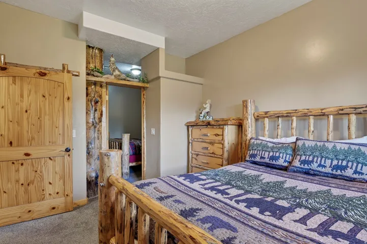 Barn door entry featuring a natural wood finish