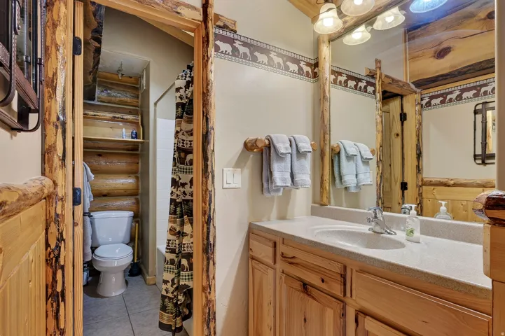 Wood-finish cabinetry with an integrated sink and light-colored countertop