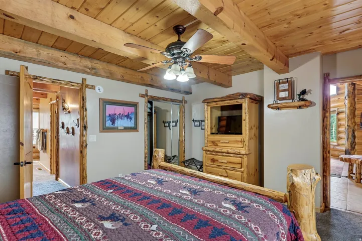 Wood-paneled ceiling with exposed wood beams